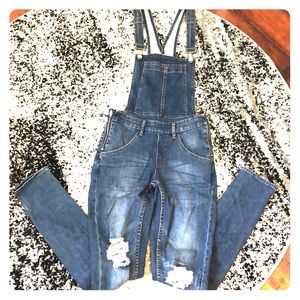 Distressed skinny overalls